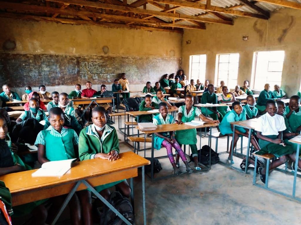 Students seated in a classroom supported by Munnex Foundation