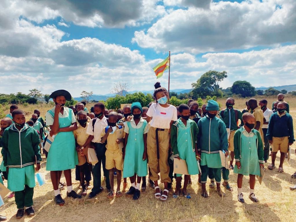 Group of schoolchildren outdoors with supporters